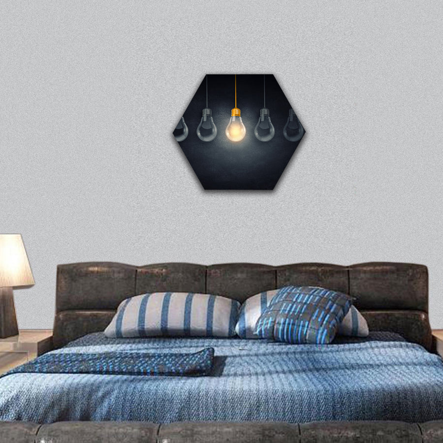Light bulbs on dark background with one glowing hexagonal canvas wall art