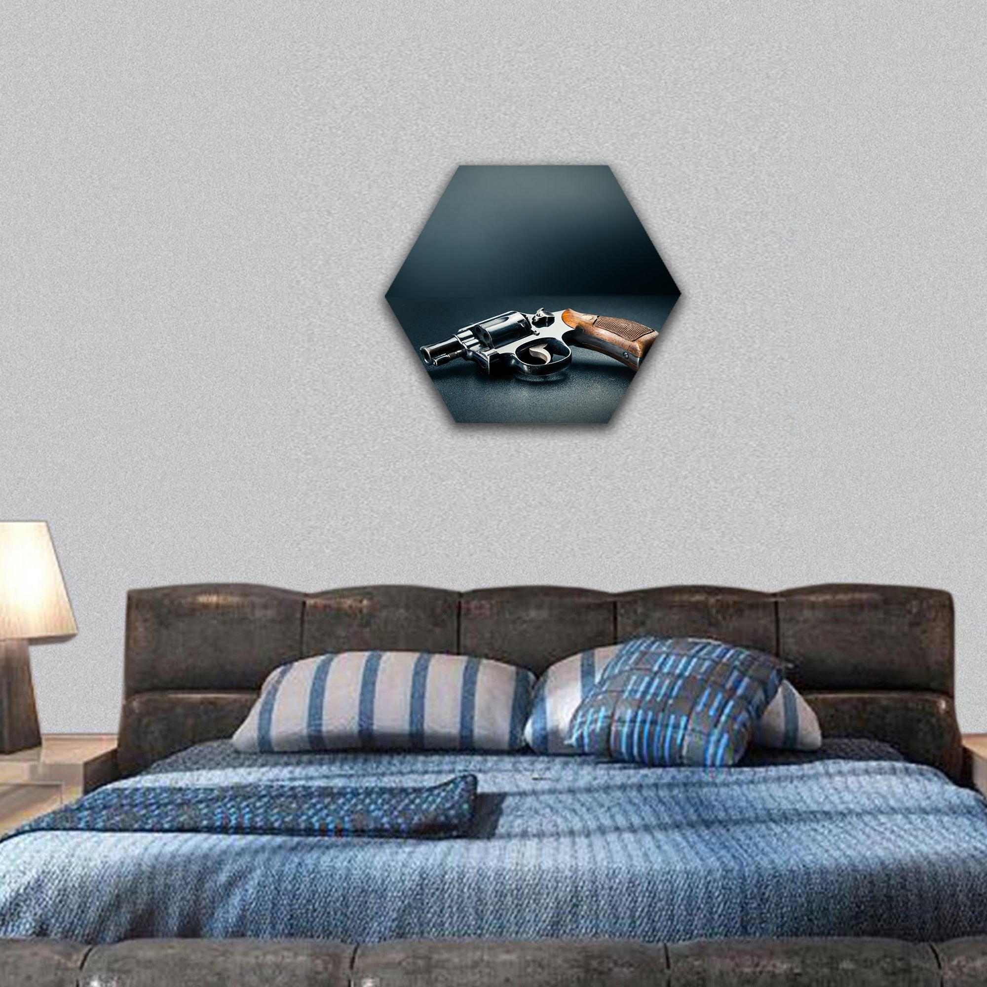 Gun sitting on a table with bullet shells hexagonal canvas wall art