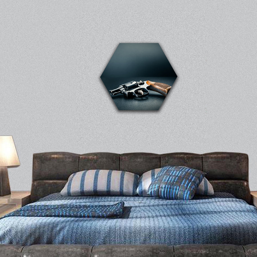 Gun sitting on a table with bullet shells hexagonal canvas wall art
