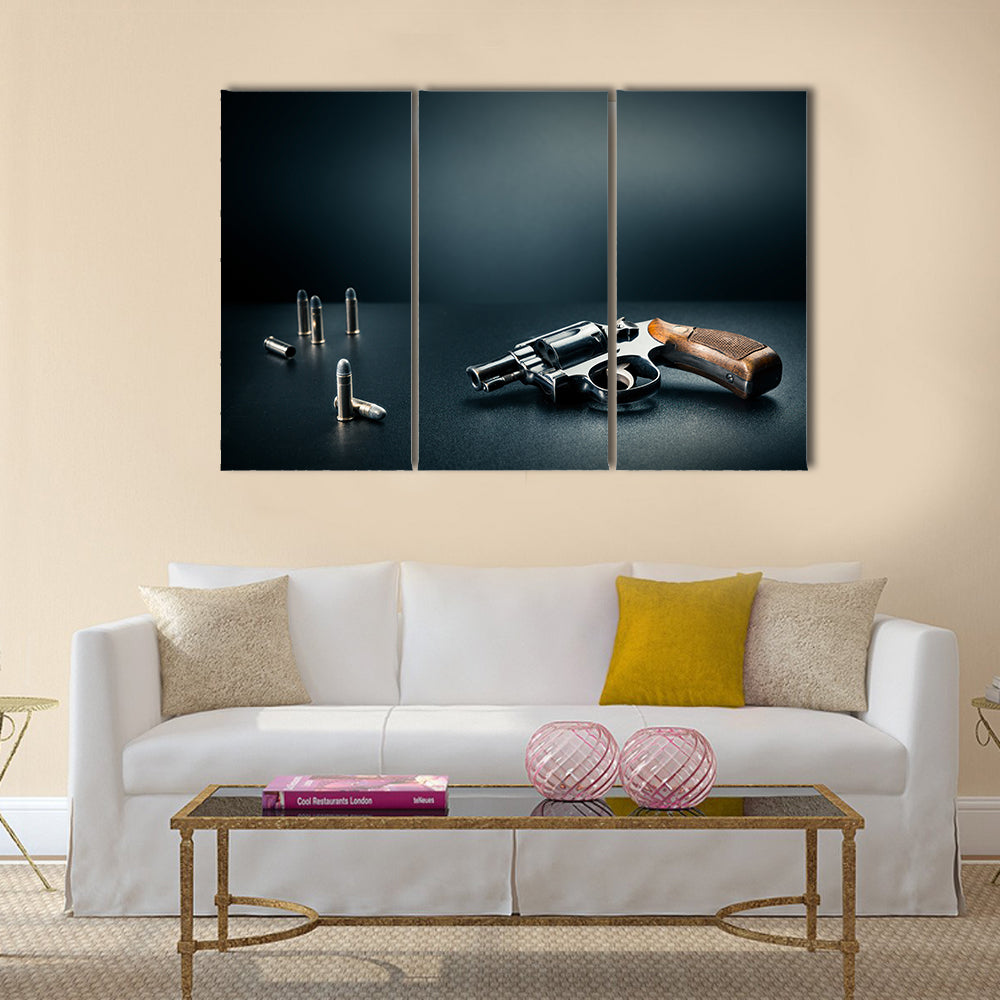 gun sitting on a table with bullet shells multi panel canvas wall art