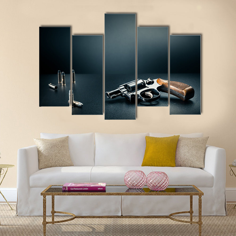 gun sitting on a table with bullet shells multi panel canvas wall art