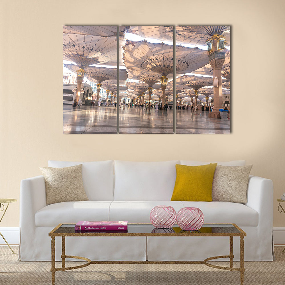 Pilgrims walk underneath giant umbrellas at Nabawi Mosque multi panel canvas wall art