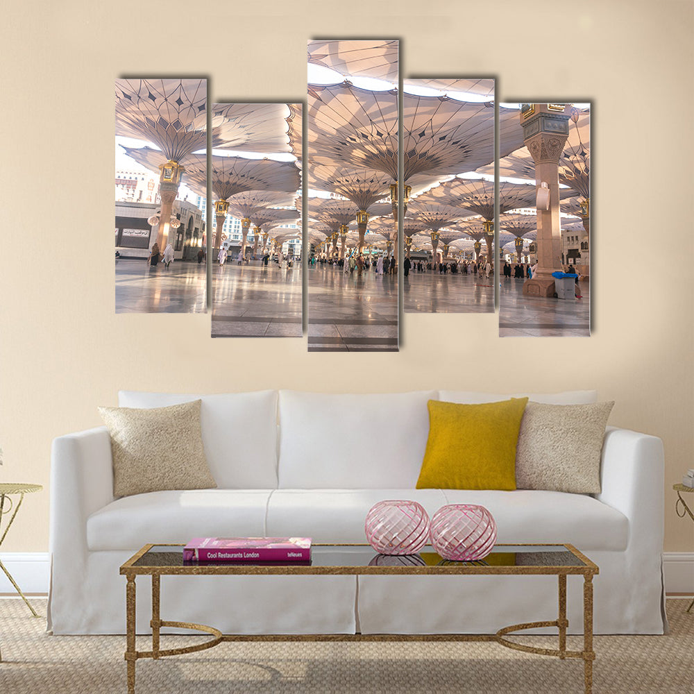 Pilgrims walk underneath giant umbrellas at Nabawi Mosque multi panel canvas wall art