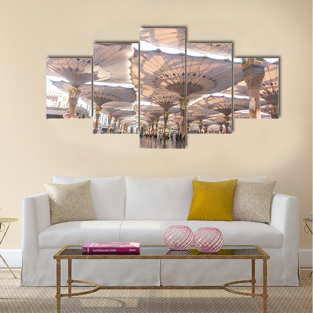 Pilgrims walk underneath giant umbrellas at Nabawi Mosque multi panel canvas wall art