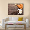 Coffee cup and fresh baked croissants on wooden background Multi Panel Canvas Wall Art