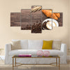 Coffee cup and fresh baked croissants on wooden background Multi Panel Canvas Wall Art