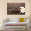 Coffee cup and coffee beans on wooden background Multi Panel Canvas Wall Art