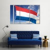 Waving flag of Netherlands on flagpole Multi panel canvas wall art