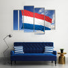 Waving flag of Netherlands on flagpole Multi panel canvas wall art