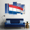 Waving flag of Netherlands on flagpole Multi panel canvas wall art