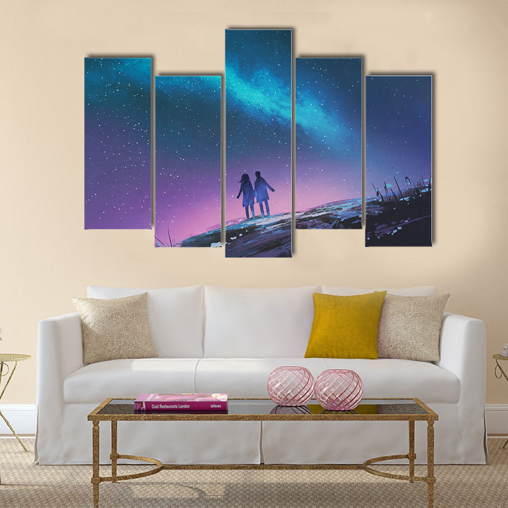 Young couple standing holding hands against the Milky Way galaxy Multi Panel Canvas Wall Art