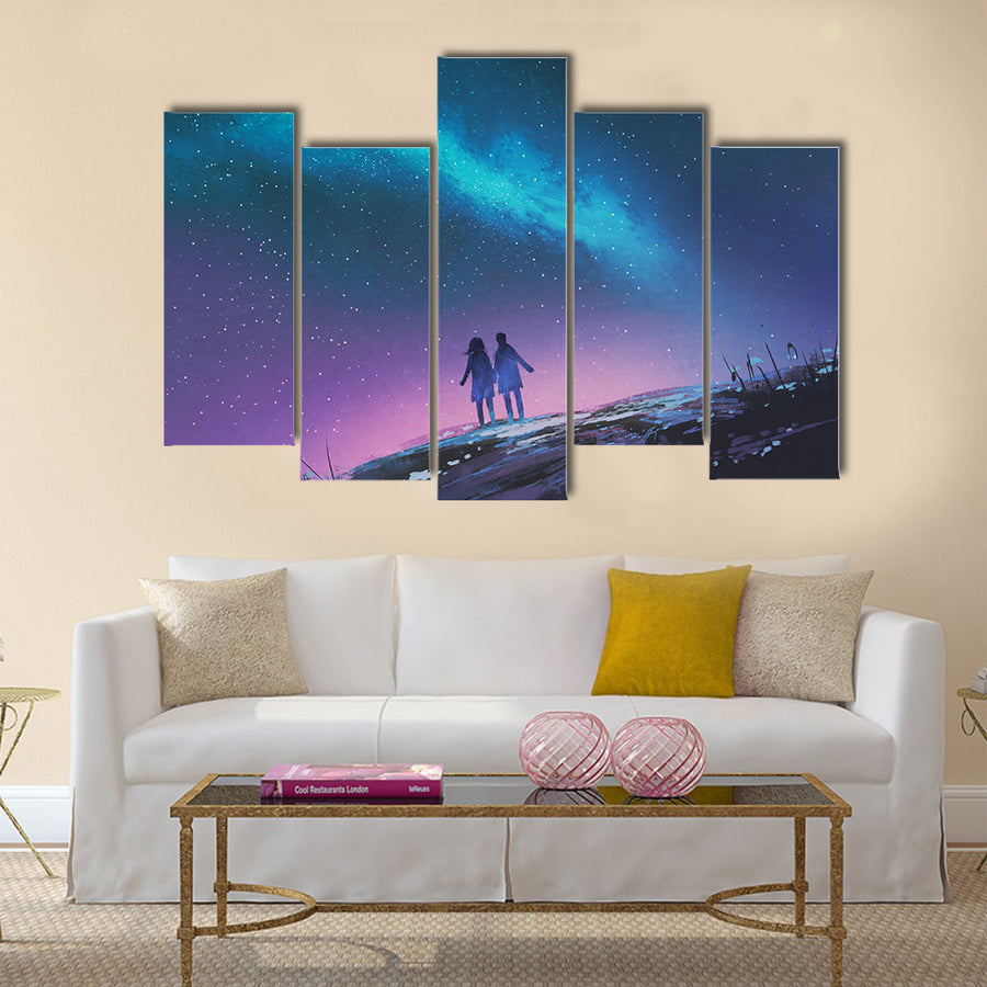 Young couple standing holding hands against the Milky Way galaxy Multi Panel Canvas Wall Art