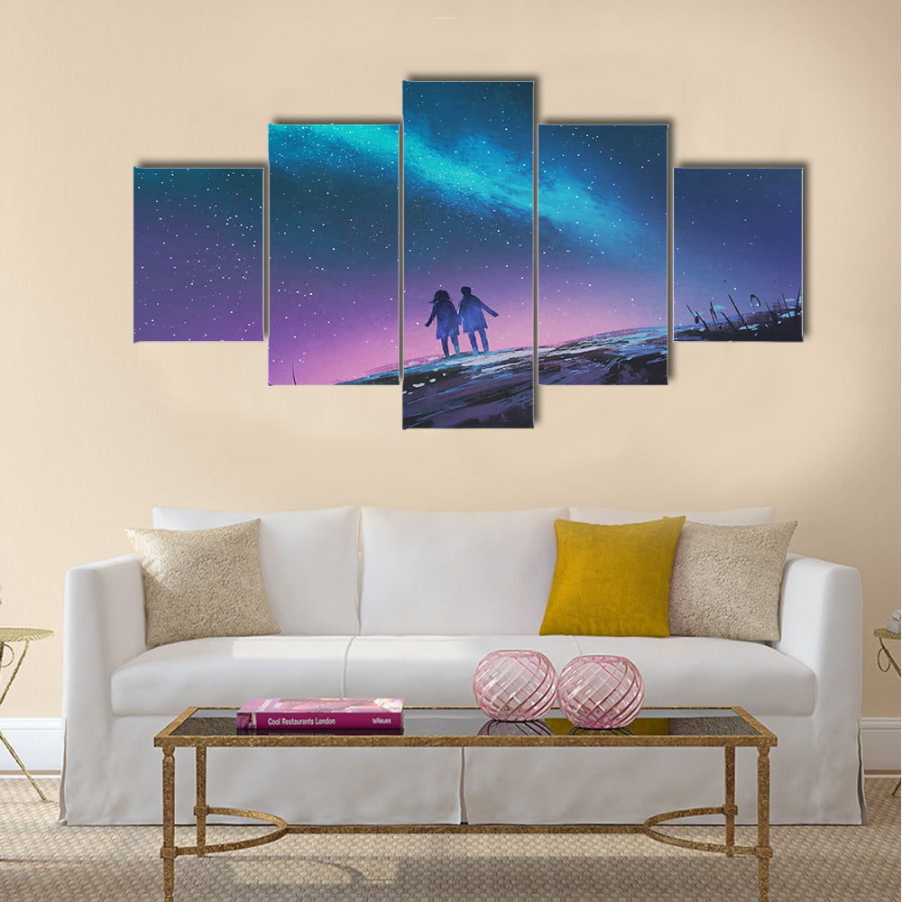 Young couple standing holding hands against the Milky Way galaxy Multi Panel Canvas Wall Art