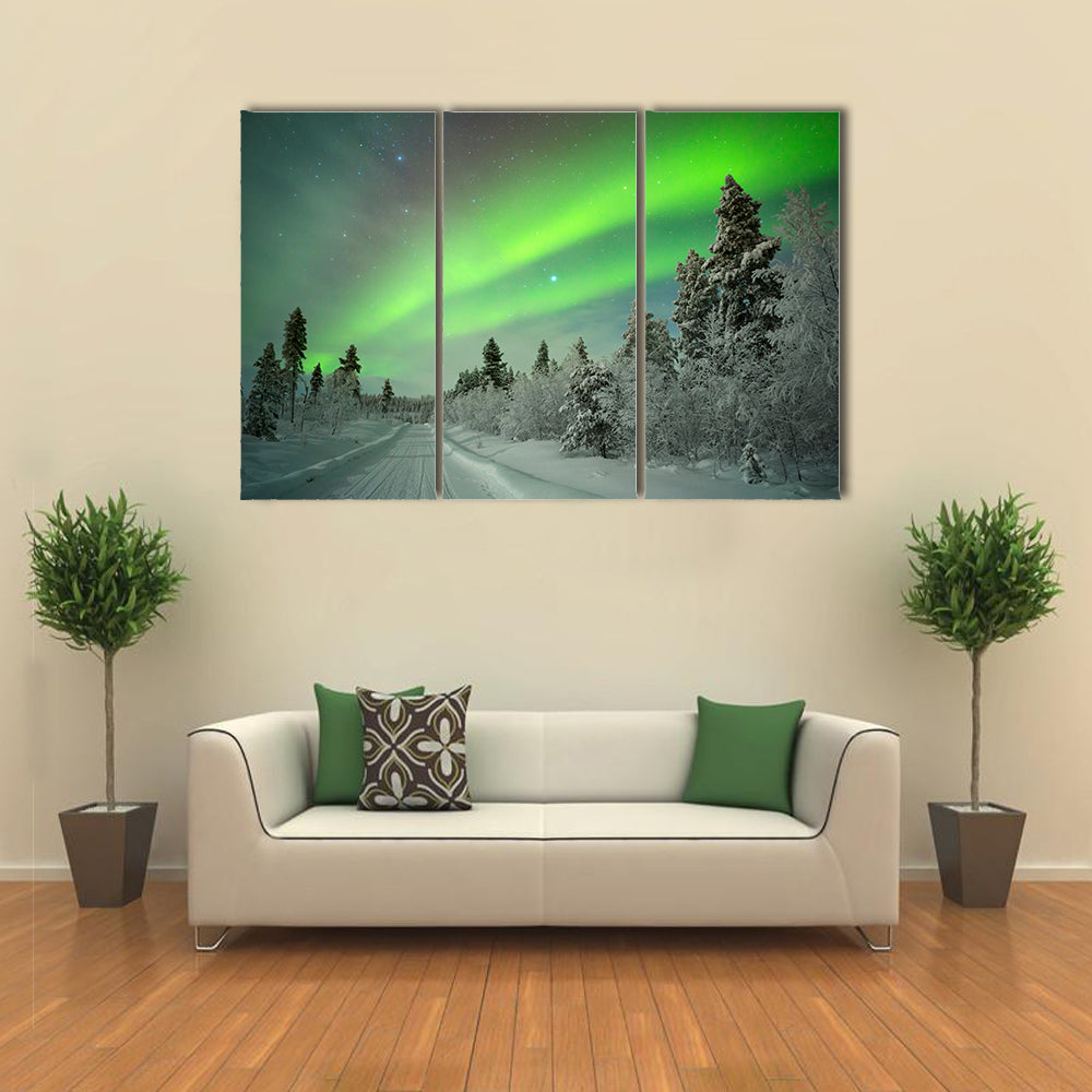 northern lights on a track through winter landscape Multi panel canvas wall art