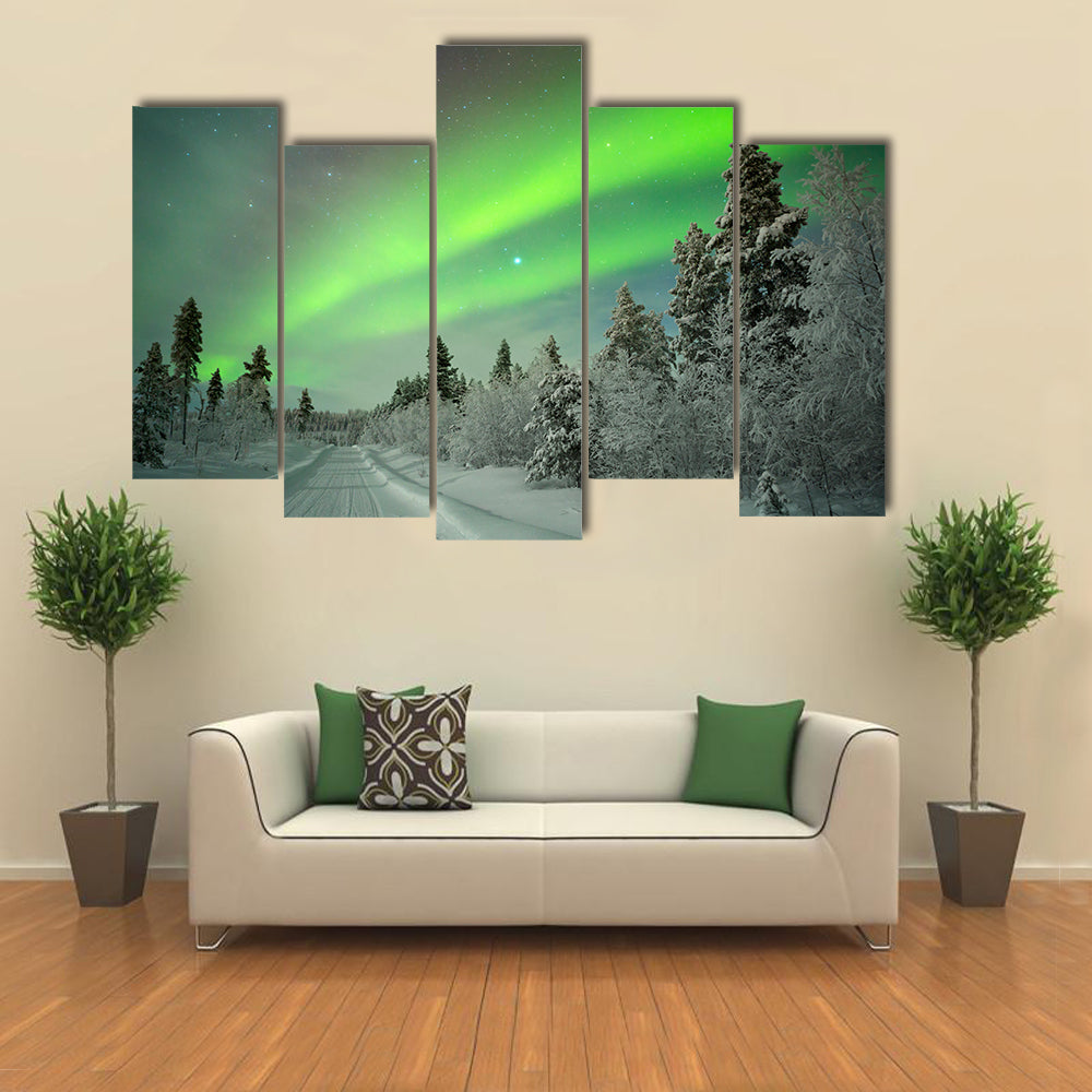 northern lights on a track through winter landscape Multi panel canvas wall art