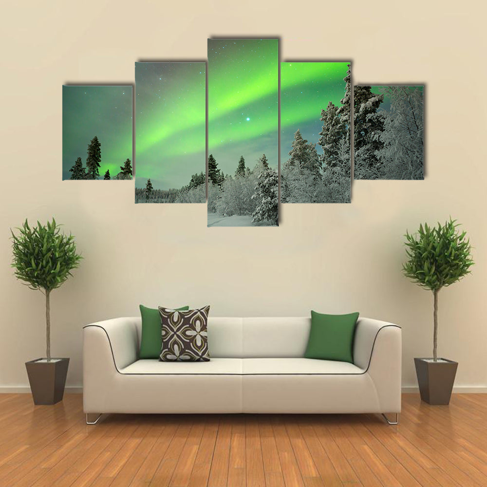 northern lights on a track through winter landscape Multi panel canvas wall art