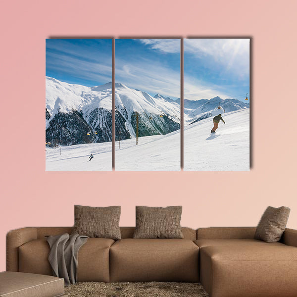 Skiers on the slope of Ski resort Livigno. Italy Multi panel canvas wall art