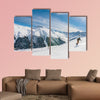 Skiers on the slope of Ski resort Livigno. Italy Multi panel canvas wall art