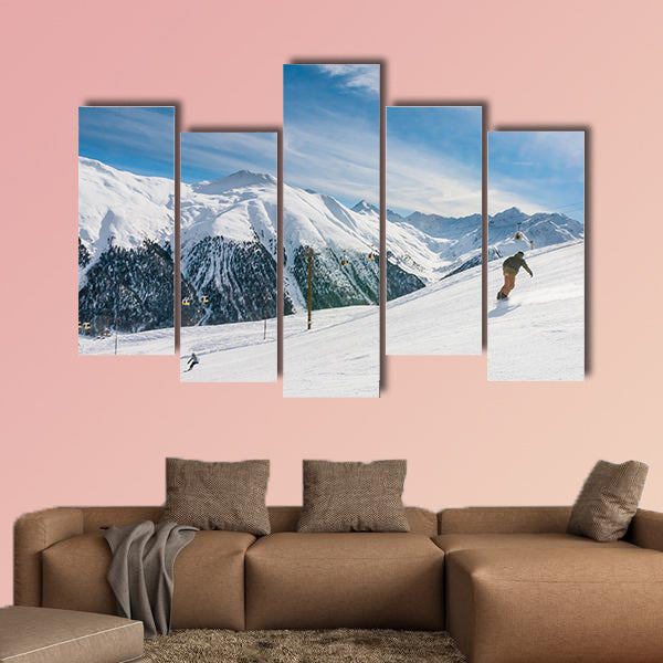 Skiers on the slope of Ski resort Livigno. Italy Multi panel canvas wall art