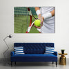 Tennis player holding racket and ball in hands Multi panel canvas wall art