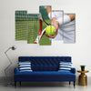 Tennis player holding racket and ball in hands Multi panel canvas wall art