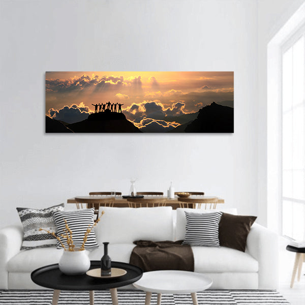 A group of people stands on a hill panoramic canvas wall art