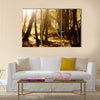 Beautiful young deer at sunset in the forest multi panel canvas wall art