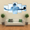 One American football player portrait in silhouette shadow on white background Multi panel canvas wall art