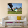 Close-up of young soccer player taking a penalty kick against a young blurred boy Multi panel canvas wall art