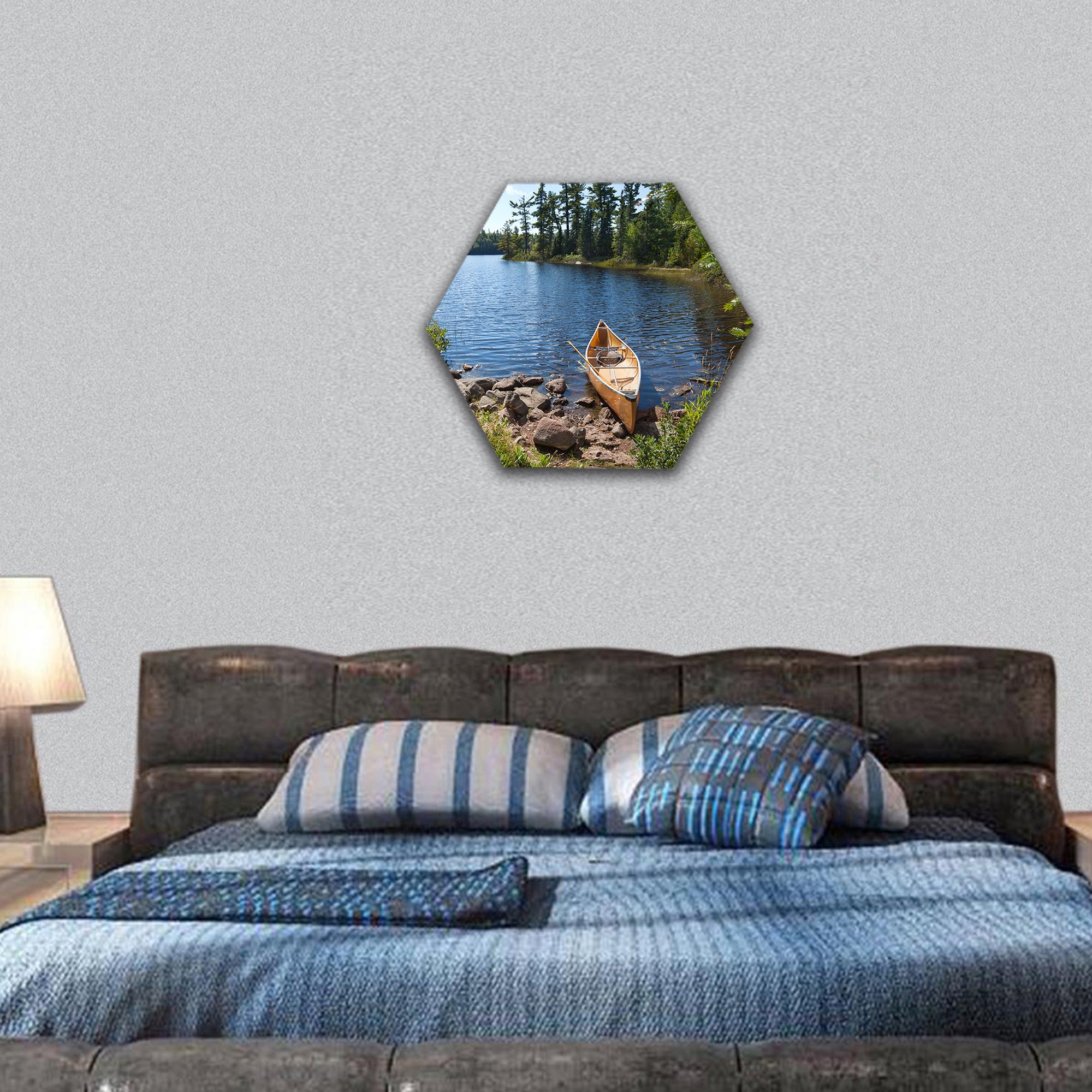 Fisherman's canoe on a rocky shore of Minnesota lake hexagonal canvas wall art