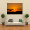 Elephants in African savannah at sunset multi panel canvas wall art