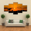 Elephants in African savannah at sunset multi panel canvas wall art