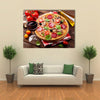 Italian pizza pepperoni tomatoes olives basil and red wine on wooden table Multi panel canvas wall art