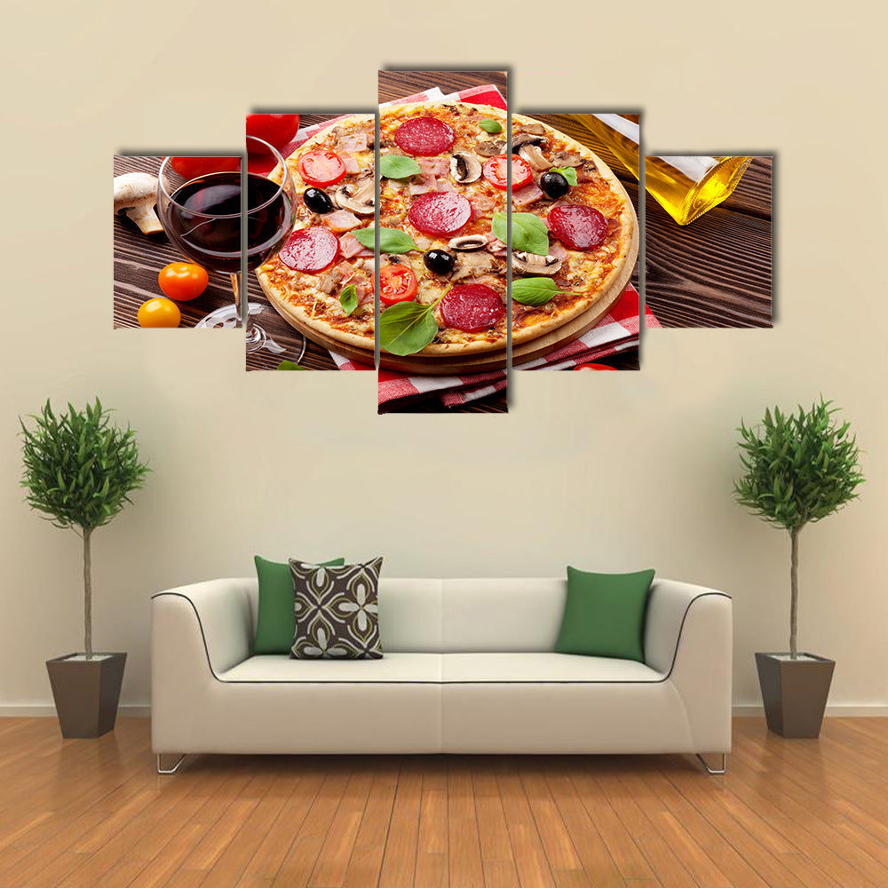 Italian pizza pepperoni tomatoes olives basil and red wine on wooden table Multi panel canvas wall art