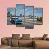 Classic american car drive on Malecon sea front promenade canvas wall art