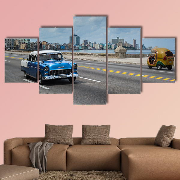 Classic american car drive on Malecon sea front promenade canvas wall art