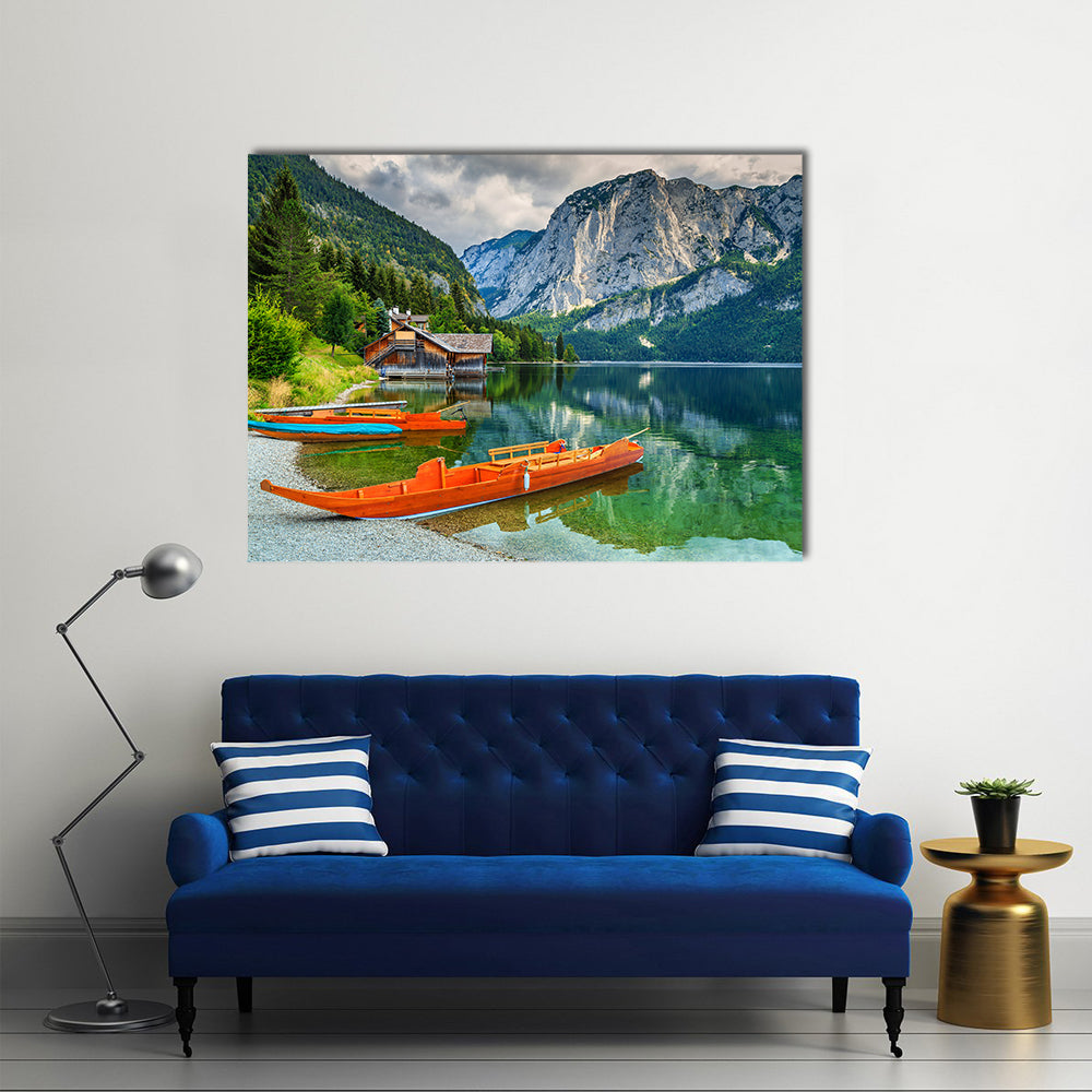Wooden boat dock with traditional boats and high rocky mountains multi panel canvas wall art