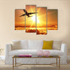 Plane takes off at sunrise multi panel canvas wall art