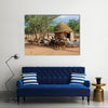 Himba village with traditional huts near Etosha National Park in Namibia Africa Multi panel canvas wall art