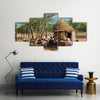 Himba village with traditional huts near Etosha National Park in Namibia Africa Multi panel canvas wall art