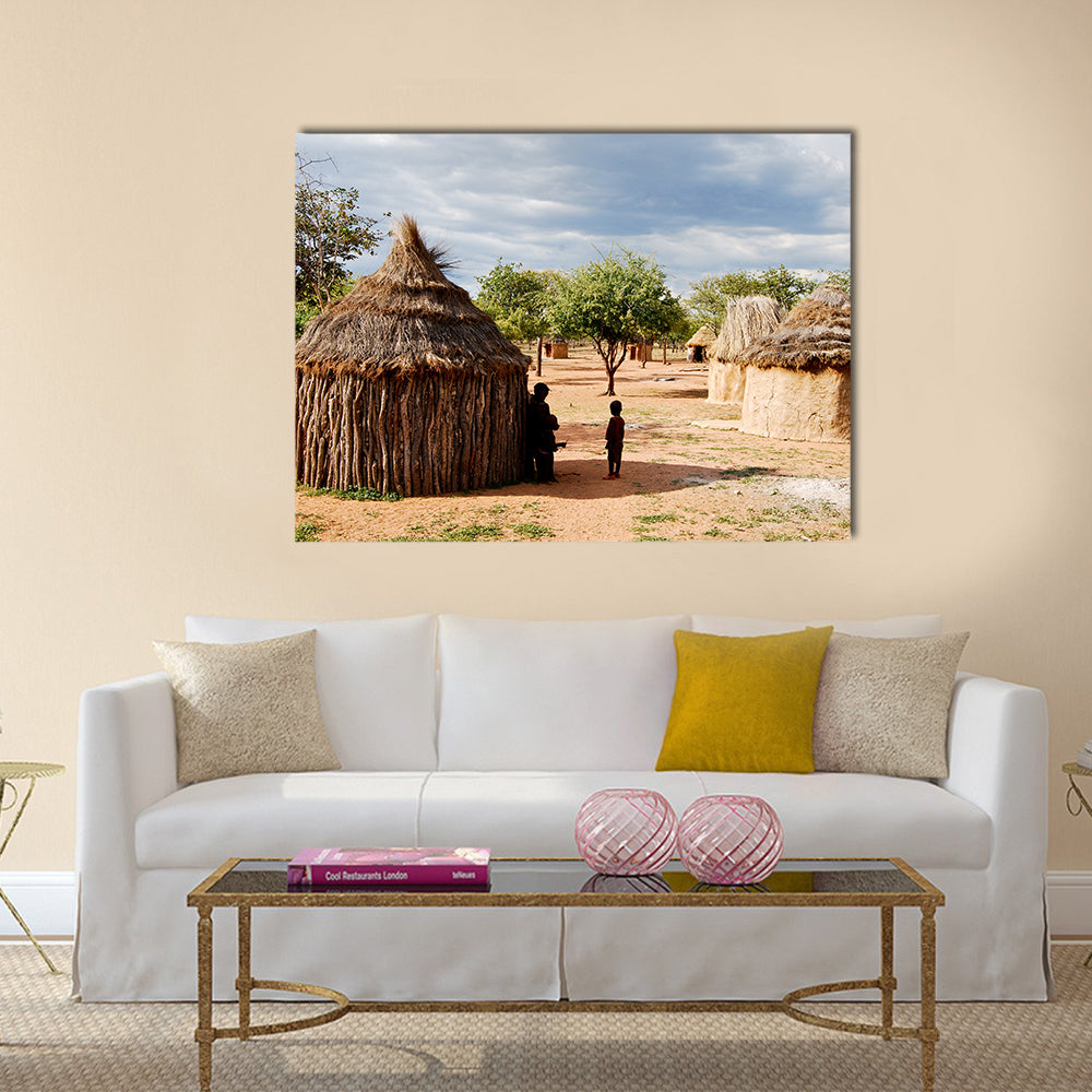 Himba village with traditional huts near Etosha National Park in Namibia, Africa Multi panel canvas wall art