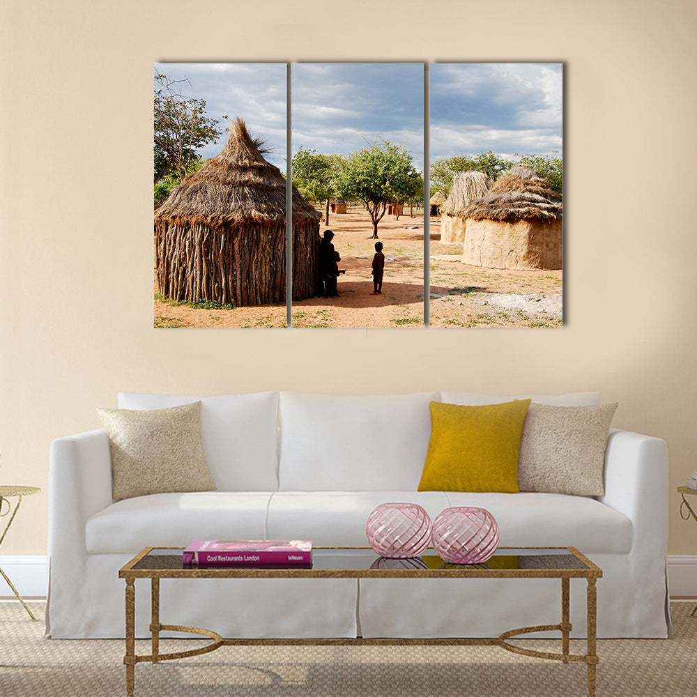 Himba village with traditional huts near Etosha National Park in Namibia, Africa Multi panel canvas wall art