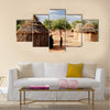 Himba village with traditional huts near Etosha National Park in Namibia, Africa Multi panel canvas wall art