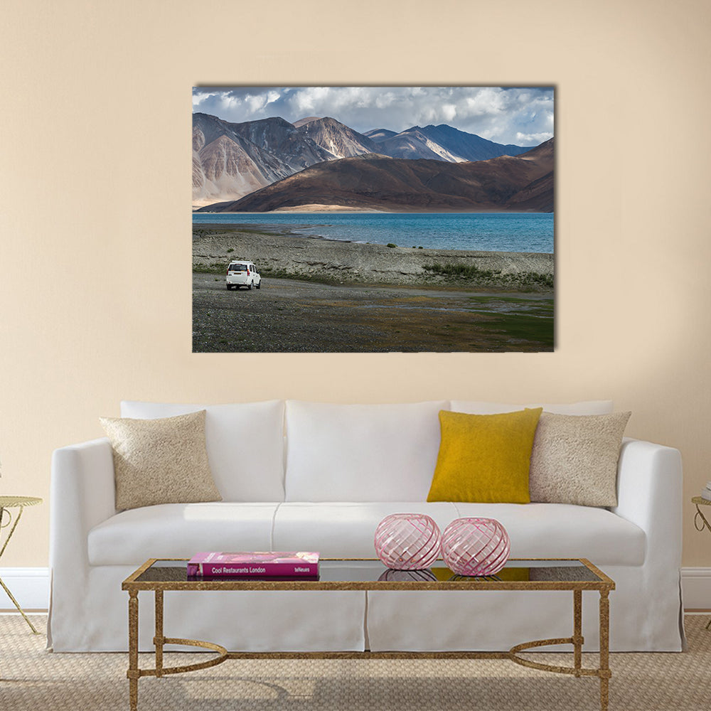 White car at Pangong lake with beauty view surrounded by mountain  multi panel canvas wall art