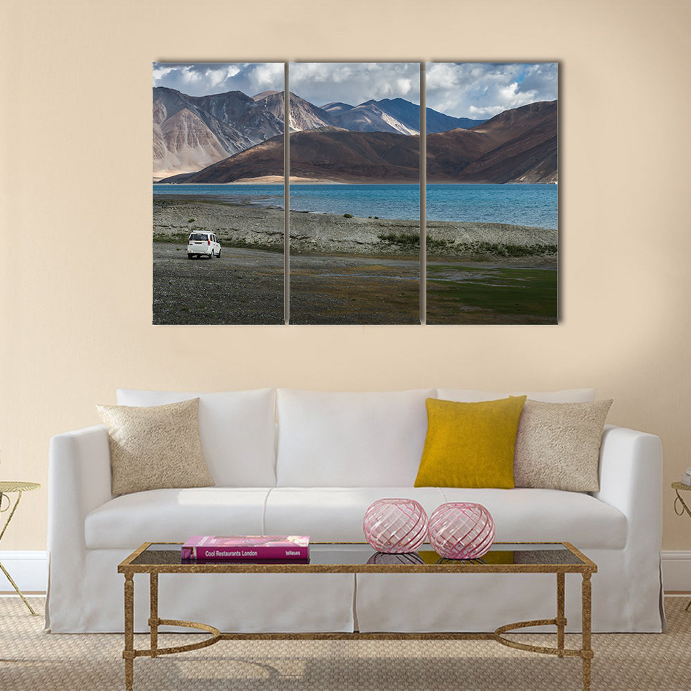 White car at Pangong lake with beauty view surrounded by mountain  multi panel canvas wall art