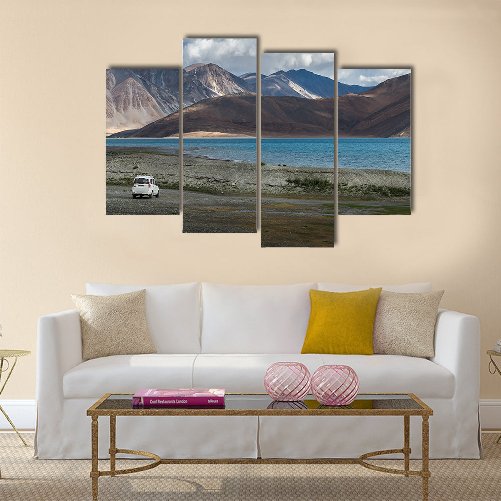 White car at Pangong lake with beauty view surrounded by mountain  multi panel canvas wall art