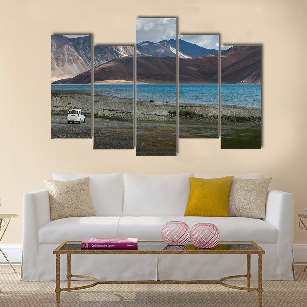 White car at Pangong lake with beauty view surrounded by mountain  multi panel canvas wall art