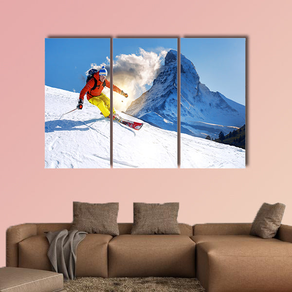 Skier skiing downhill against Matterhorn peak in Switzerland Multi panel canvas wall art