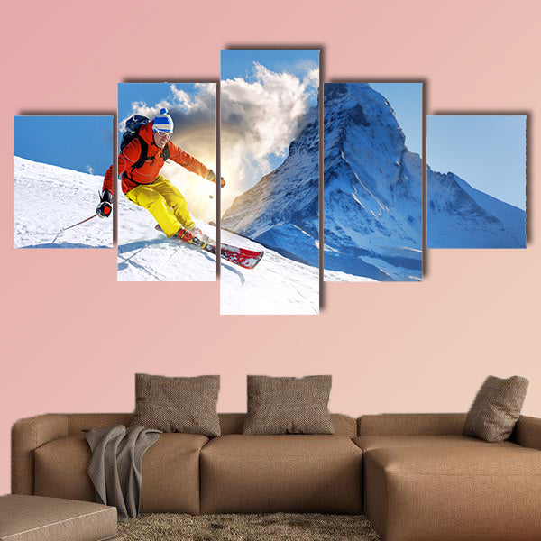 Skier skiing downhill against Matterhorn peak in Switzerland Multi panel canvas wall art