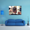 Back view of Man in Barber shop Barber Cutting Hair with Scissors Multi Panel Canvas Wall Art